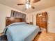Large bedroom with ceiling fan, dresser, and hardwood floors at 504 N Pine Ln, Wadesboro, NC 28170
