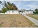 Charming single story home with a well-maintained lawn and walkway at 504 N Pine Ln, Wadesboro, NC 28170