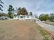 Front view of ranch house with driveway and lawn at 504 N Pine Ln, Wadesboro, NC 28170