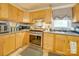 Bright kitchen with wood cabinets and stainless steel appliances at 504 N Pine Ln, Wadesboro, NC 28170