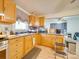 Functional kitchen featuring wood cabinets and a stainless steel stove at 504 N Pine Ln, Wadesboro, NC 28170