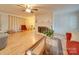 Living room with hardwood floors and a brick fireplace at 504 N Pine Ln, Wadesboro, NC 28170