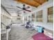 Spacious screened porch with ceiling fan and wood-look flooring at 504 N Pine Ln, Wadesboro, NC 28170