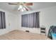 Second bedroom with hardwood floors and gray curtains at 504 N Pine Ln, Wadesboro, NC 28170