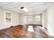 Bright sunroom with wood flooring and access to outdoors at 579 Gibson Nw St, Concord, NC 28025