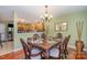 Dining room with wood table and chairs and a view into the kitchen at 7546 Lady Liberty Ln, Charlotte, NC 28217