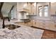 Modern kitchen featuring granite countertops and stainless steel appliances at 8058 Edgewater Dr, Norwood, NC 28128