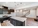 Open concept kitchen with island, stainless steel appliances, and view of living room at 14858 Tamarack Dr, Charlotte, NC 28278