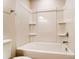 Clean bathroom with a tub/shower combo and built-in shelves at 14862 Tamarack Dr, Charlotte, NC 28278