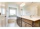 Bathroom featuring a soaking tub, double vanity, and toilet at 14862 Tamarack Dr, Charlotte, NC 28278