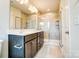 Modern bathroom with double vanity, large mirror, and walk-in shower at 14862 Tamarack Dr, Charlotte, NC 28278