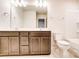 Double vanity bathroom with a large mirror and toilet at 14862 Tamarack Dr, Charlotte, NC 28278