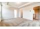 Spacious bedroom with carpeted floor and access to bathroom and hallway at 14862 Tamarack Dr, Charlotte, NC 28278