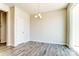 Simple dining area with hardwood floors and a chandelier at 14862 Tamarack Dr, Charlotte, NC 28278