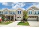 Attractive townhome community featuring two-story homes with garages at 14862 Tamarack Dr, Charlotte, NC 28278