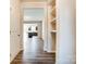 Hardwood floor open foyer with view into kitchen and living areas at 14862 Tamarack Dr, Charlotte, NC 28278