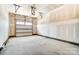 Unfinished garage with overhead door and ample space at 14862 Tamarack Dr, Charlotte, NC 28278