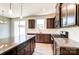 Modern kitchen with granite countertops, dark cabinetry, and stainless steel appliances at 14862 Tamarack Dr, Charlotte, NC 28278