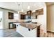 Modern kitchen with dark brown cabinets and granite countertops at 14862 Tamarack Dr, Charlotte, NC 28278