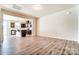 Living area with hardwood floors and open kitchen at 14862 Tamarack Dr, Charlotte, NC 28278