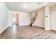 Spacious living room with hardwood floors and staircase at 14862 Tamarack Dr, Charlotte, NC 28278
