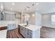 Modern kitchen with gray cabinets, quartz countertops, and an island at 14866 Tamarack Dr, Charlotte, NC 28278