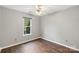 Bedroom with wood-look floors, ceiling fan, and a window at 2306 Morningside Dr, Lancaster, SC 29720