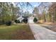 Tan house with a two car garage and a large yard at 2306 Morningside Dr, Lancaster, SC 29720