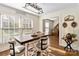 Bright dining area with a rustic table and view to the living room at 2675 Faith Rd, Salisbury, NC 28146