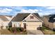 Charming two-story home with attached garage and manicured landscaping at 3006 Cricket Ln, Lancaster, SC 29720