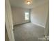 Bright bedroom featuring neutral walls and carpeting at 401 Imperial Way # 25, Albemarle, NC 28001