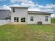 Rear view of a two-story house with a patio at 5065 Thomasville Dr, Belmont, NC 28012