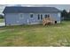 Rear view of a gray house with a deck at 51 Rosemont Dr, Stony Point, NC 28678