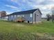 Rear view of a gray house with a deck at 51 Rosemont Dr, Stony Point, NC 28678