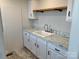 Laundry room with white cabinets and marble countertop at 51 Rosemont Dr, Stony Point, NC 28678