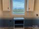 Laundry room with white cabinets and a window at 51 Rosemont Dr, Stony Point, NC 28678