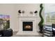 Modern gas fireplace with marble surround, adding warmth and elegance at 6416 Willow Pin Ln, Huntersville, NC 28078