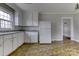 Kitchen with white cabinets, granite countertops, and tile floor at 818 Radio Rd, Statesville, NC 28677