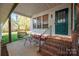 Cozy back patio with seating and a swing at 103 2Nd Nw St, Catawba, NC 28609