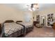 Spacious bedroom with twin beds, built-in shelving, and ample natural light at 103 2Nd Nw St, Catawba, NC 28609