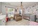 Bedroom with crib, armchair, and floral wall decor at 11638 Village Pond Dr, Charlotte, NC 28278