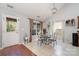 Bright dining area with glass-top table and four chairs near kitchen at 11638 Village Pond Dr, Charlotte, NC 28278