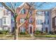 Brick front exterior of charming townhome with maroon shutters at 14446 Reese Blvd # 12, Huntersville, NC 28078