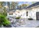 Relaxing patio with fire pit and seating area at 1524 Moss Creek Ln, Iron Station, NC 28080