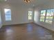 Spacious bedroom with hardwood floors and multiple windows at 405 19Th Ave Nw Cir, Hickory, NC 28601