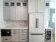 Gray kitchen cabinets with marble countertops and stainless steel appliances at 405 19Th Ave Nw Cir, Hickory, NC 28601