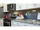 Kitchen detail showing granite countertops and backsplash at 4362 Bronze Blvd, Sherrills Ford, NC 28673