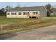 Tan single story home with a deck and yard at 568 Drumstand Rd, Stony Point, NC 28678