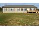 Tan single story home with a deck and spacious yard at 568 Drumstand Rd, Stony Point, NC 28678