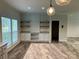 White cabinets, marble countertops, and open shelving at 568 Drumstand Rd, Stony Point, NC 28678